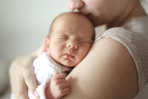 Mom and newborn baby. Light tone and soft toning