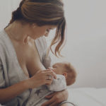mother breast feeding her baby